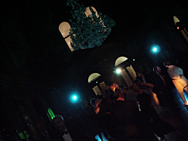 Dance party in the vestibule, tilted shot to frame chandelier