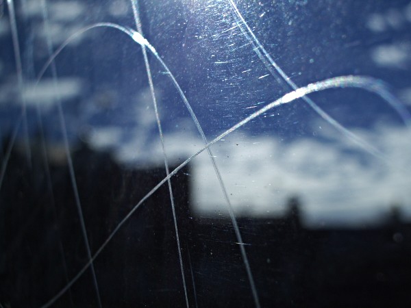 A photo of scratched glass, with an interesting impact on light refraction