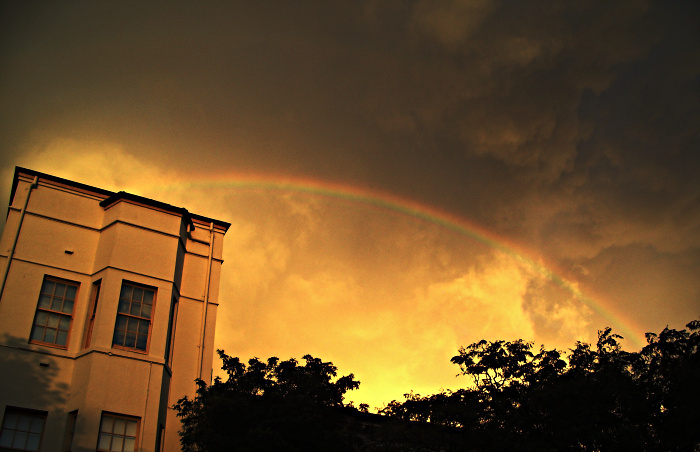 Rainbow across a yellow sky