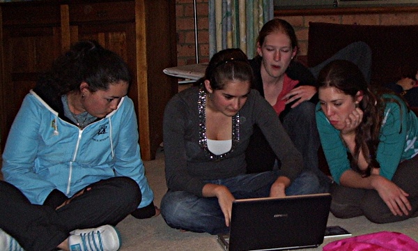 Girls huddled round a computer