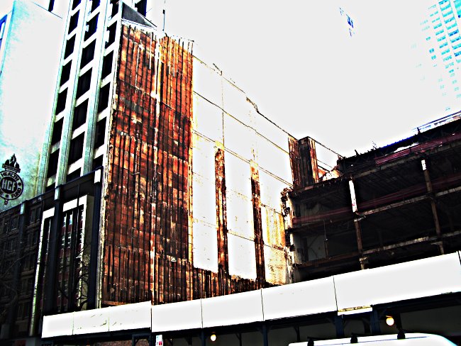 Demolition of a building in Sydney with one wall remaining