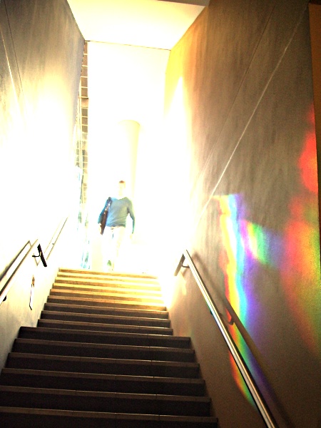 Refracting spectrum of light against a wall down a flight of stairs in Eastern Avenue Lecture Theatre complex at the University of Sydney (Usyd)