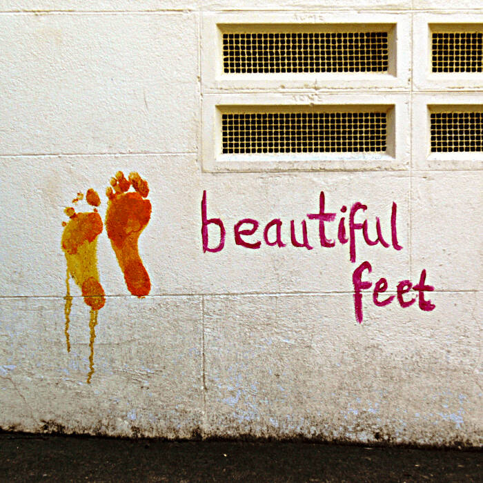 Beautiful feet and footprints painted on a wall
